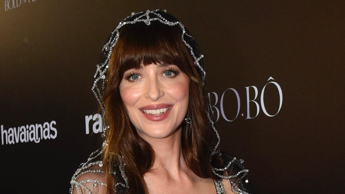 Dakota Johnson wears spiderweb dress at Vogue Carnival Ball